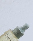 Vegan Clarifying Face Serum with natural oils in a glass bottle clip