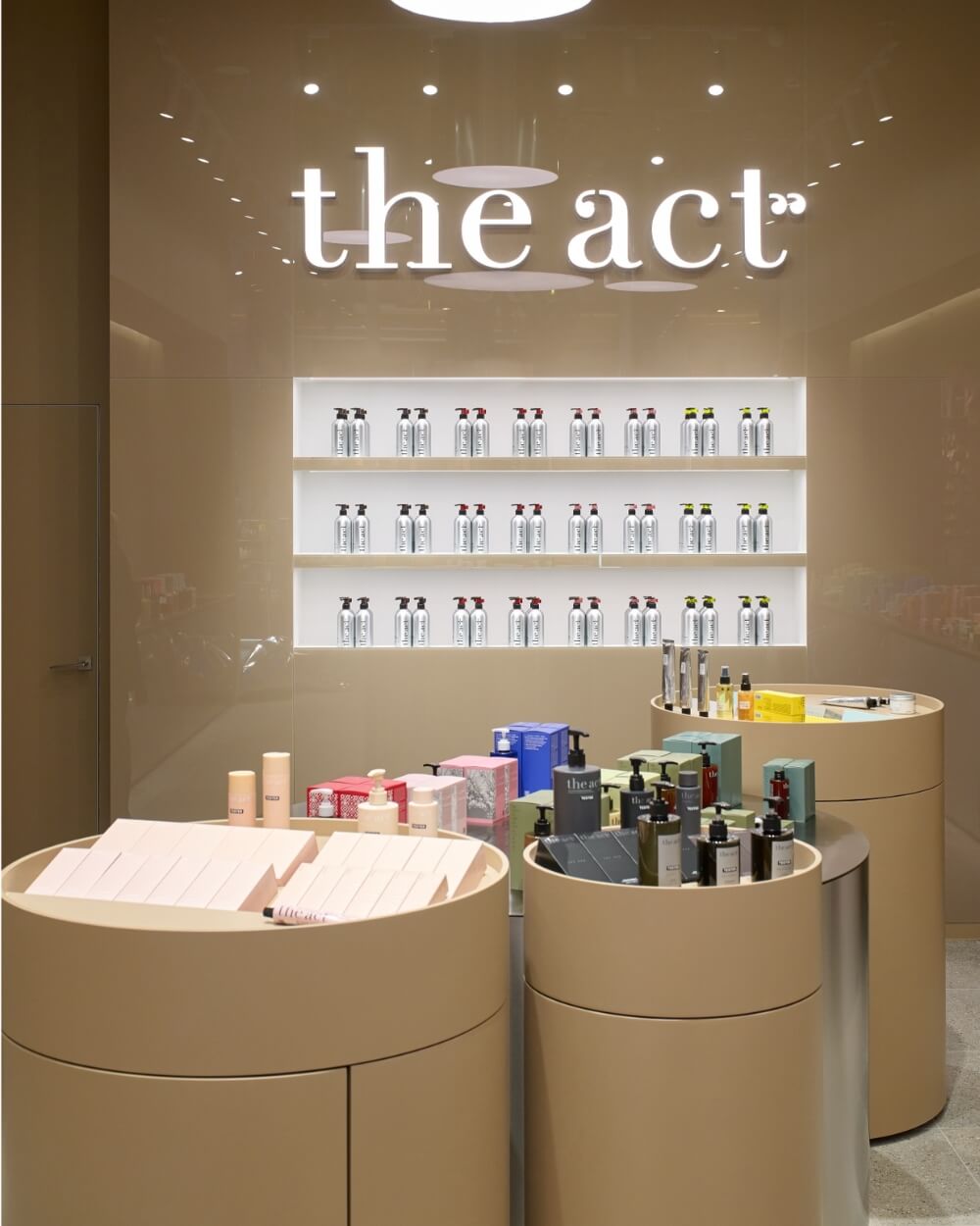 The Act retail store display featuring the full range of face, body, and hair products